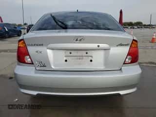 2005 Hyundai Accent GLS с VIN KMHCG35C45U329244, выставлен на аукционе Copart как лот 82548424 с пробегом 81 191 миль миль и Чистый • Clean title. История ставок и продаж доступна на DreamBid. Изображение 6.