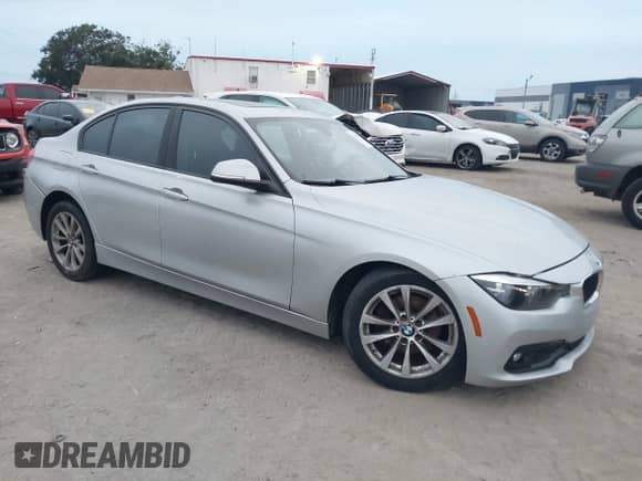 2018 BMW 3 Series 320i with VIN WBA8A9C51JAH12024, listed as a IAAI auction lot 43198146 with 98,143 mi miles and . Bid and sale history available at DreamBid. Image 1.