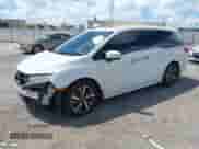 2020 Honda Odyssey Elite with VIN 5FNRL6H97LB058312, listed as a IAAI auction lot 42954678 with 92,976 mi miles and . Bid and sale history available at DreamBid. Image 2.