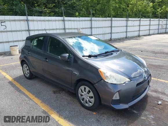 2014 Toyota Prius One with VIN JTDKDTB38E1562235, listed as a IAAI auction lot 43048418 with 164,639 mi miles and . Bid and sale history available at DreamBid. Image 1.