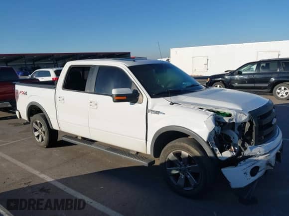 2014 Ford F-150 XLT with VIN 1FTFW1EF8EKE96026, listed as a IAAI auction lot 43410651 with 208,712 mi miles and . Bid and sale history available at DreamBid. Image 13.