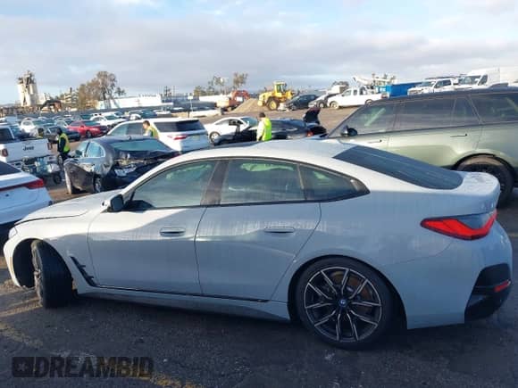 2023 BMW i4 eDrive40 with VIN WBY73AW01PFR26528, listed as a IAAI auction lot 41578844 with 19,636 mi miles and . Bid and sale history available at DreamBid. Image 14.