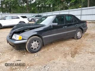 1999 Mercedes-Benz C 230/260/280/320 z VIN WDBHA24G2XA793372, wystawiony jako Copart lot #70006645 z przebiegiem 84 517 mil mil oraz Szkoda całkowita • Salvage title. Historia ofert i sprzedaży dostępna na DreamBid. Obrazek 1.