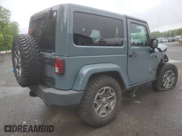 2014 Jeep Wrangler Rubicon with VIN 1C4BJWCG9EL144749, listed as a Copart auction lot 57022735 with 160,529 mi miles and Salvage title. Bid and sale history available at DreamBid. Image 3.