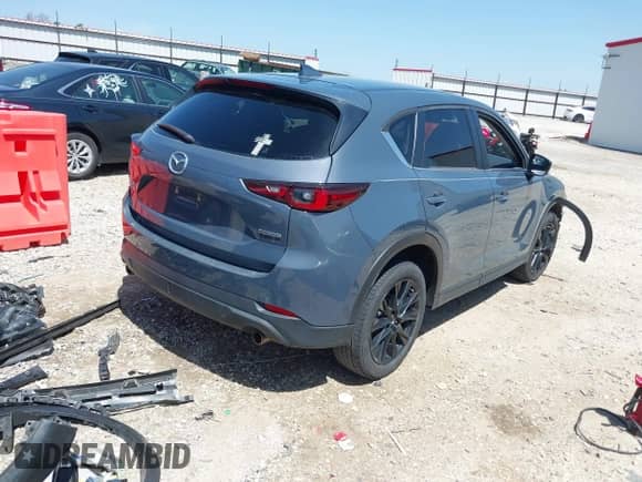 2022 Mazda CX-5 S Carbon Edition z VIN JM3KFBCM7N1543338, wystawiony jako IAAI lot #41994700 z przebiegiem 67 855 mil mil oraz . Historia ofert i sprzedaży dostępna na DreamBid. Obrazek 4.