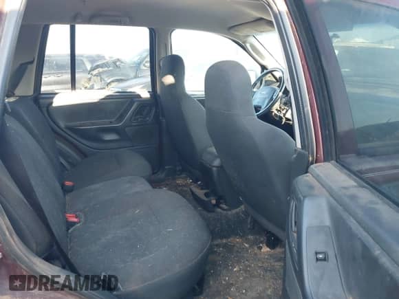 2003 Jeep Grand Cherokee Laredo z VIN 1J4GX48S83C551023, wystawiony jako IAAI lot #43186986 z przebiegiem 176 490 mil mil oraz . Historia ofert i sprzedaży dostępna na DreamBid. Obrazek 8.