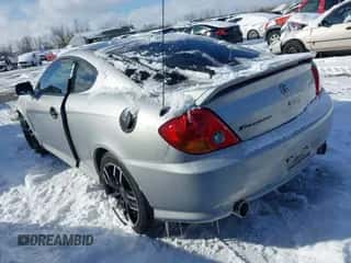 2003 Hyundai Tiburon GT с VIN KMHHN65F73U017682, выставлен на аукционе IAAI как лот 41551560 с пробегом 112 904 миль миль и . История ставок и продаж доступна на DreamBid. Изображение 3.