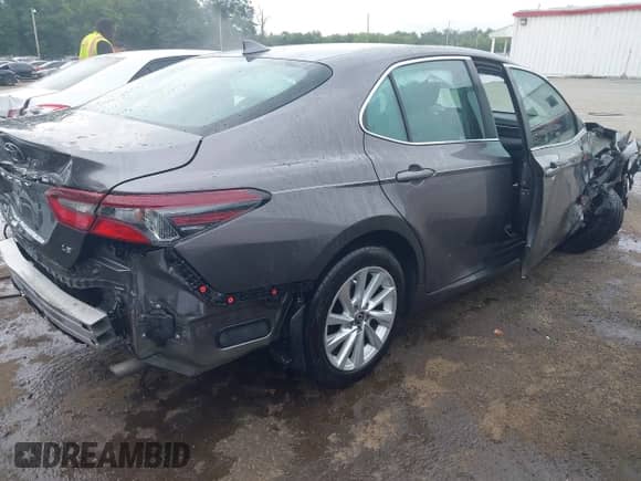2023 Toyota Camry LE z VIN 4T1C11AK3PU141255, wystawiony jako IAAI lot #42938395 z przebiegiem 59 258 mil mil oraz . Historia ofert i sprzedaży dostępna na DreamBid. Obrazek 4.
