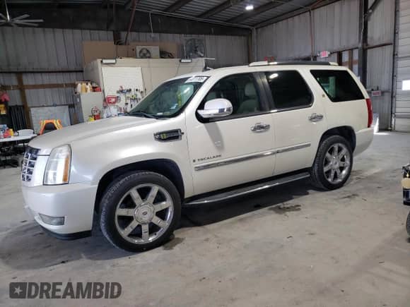 2009 Cadillac Escalade z VIN 1GYFK43569R209961, wystawiony jako Copart lot #54011705 z przebiegiem 143 894 mil mil oraz Czysty tytuł • Clean title. Historia ofert i sprzedaży dostępna na DreamBid. Obrazek 1.