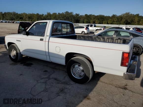 1992 Dodge Dakota z VIN 1B7FL26XXNS690465, wystawiony jako Copart lot #77436274 z przebiegiem 112 226 mil mil oraz Czysty tytuł • Clean title. Historia ofert i sprzedaży dostępna na DreamBid. Obrazek 2.