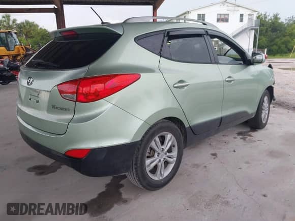 2011 Hyundai Tucson GLS with VIN KM8JU3AC1BU197092, listed as a IAAI auction lot 42653214 with 107,883 mi miles and . Bid and sale history available at DreamBid. Image 4.
