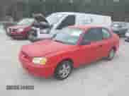 2002 Hyundai Accent GS z VIN KMHCG35C32U157056, wystawiony jako IAAI lot #41538381 z przebiegiem 127 518 mil mil oraz . Historia ofert i sprzedaży dostępna na DreamBid. Obrazek 2.