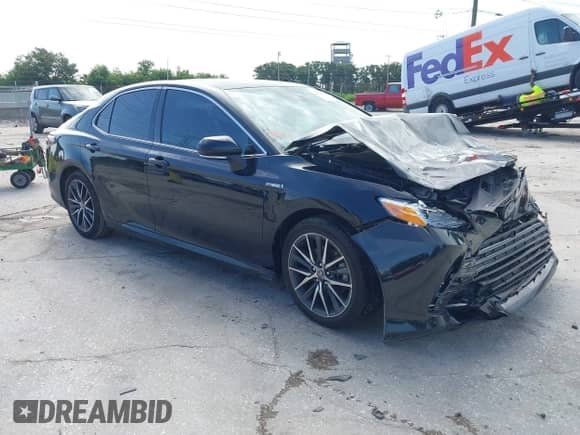 2021 Toyota Camry Hybrid XLE with VIN 4T1F31AK2MU029260, listed as a IAAI auction lot 42639954 with 59,325 mi miles and . Bid and sale history available at DreamBid. Image 1.