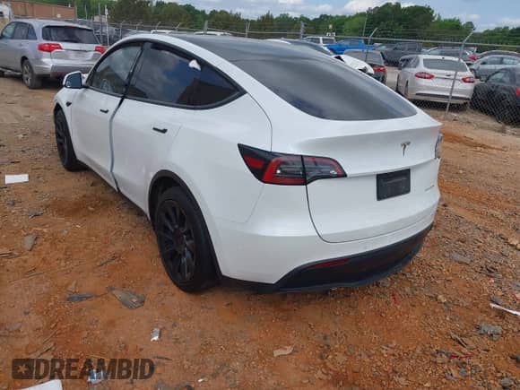 2022 Tesla Model Y Long Range z VIN 7SAYGDEE2NF385910, wystawiony jako IAAI lot #42146793 z przebiegiem 67 604 mil mil oraz . Historia ofert i sprzedaży dostępna na DreamBid. Obrazek 3.