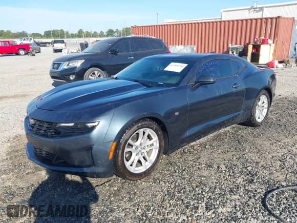 2021 Chevrolet Camaro 1LS with VIN 1G1FB1RX5M0130963, listed as a IAAI auction lot 43284790 with 57,472 mi miles and . Bid and sale history available at DreamBid. Image 2.