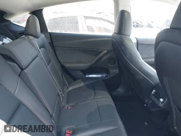 2023 Tesla Model Y Long Range with VIN 7SAYGDEE5PF865572, listed as a IAAI auction lot 43067262 with 56,508 mi miles and . Bid and sale history available at DreamBid. Image 8.