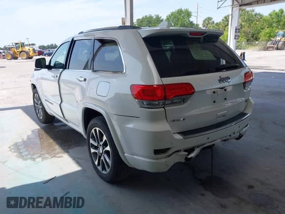 2018 Jeep Grand Cherokee Overland with VIN 1C4RJFCG8JC229381, listed as a IAAI auction lot 42221266 with 102,230 mi miles and . Bid and sale history available at DreamBid. Image 3.