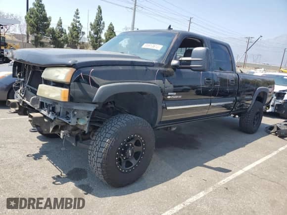 2007 Chevrolet Silverado 2500HD LT1 with VIN 1GCHK23D27F188499, listed as a Copart auction lot 68913615 with 183,816 mi miles and Salvage title. Bid and sale history available at DreamBid. Image 1.