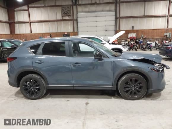 2022 Mazda CX-5 S Preferred z VIN JM3KFBCM1N0551165, wystawiony jako IAAI lot #42277023 z przebiegiem 34 115 mil mil oraz . Historia ofert i sprzedaży dostępna na DreamBid. Obrazek 12.