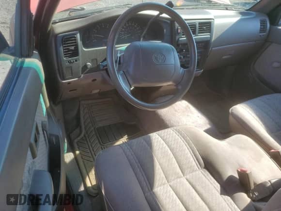 1995 Toyota Tacoma z VIN 4TAUN53B9SZ077425, wystawiony jako Copart lot #70768285 z przebiegiem 124 789 mil mil oraz Czysty tytuł • Clean title. Historia ofert i sprzedaży dostępna na DreamBid. Obrazek 8.