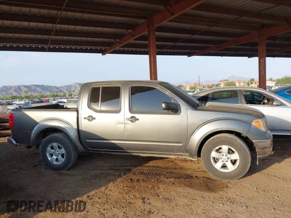 2007 Nissan Frontier SE z VIN 1N6AD07U67C435631, wystawiony jako IAAI lot #42723367 z przebiegiem 193 871 mil mil oraz . Historia ofert i sprzedaży dostępna na DreamBid. Obrazek 13.