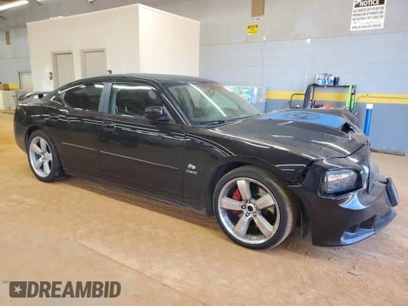 2007 Dodge Charger SRT-8 with VIN 2B3KA73W67H652417, listed as a Copart auction lot 70518705 with 75,440 mi miles and Salvage title. Bid and sale history available at DreamBid. Image 4.