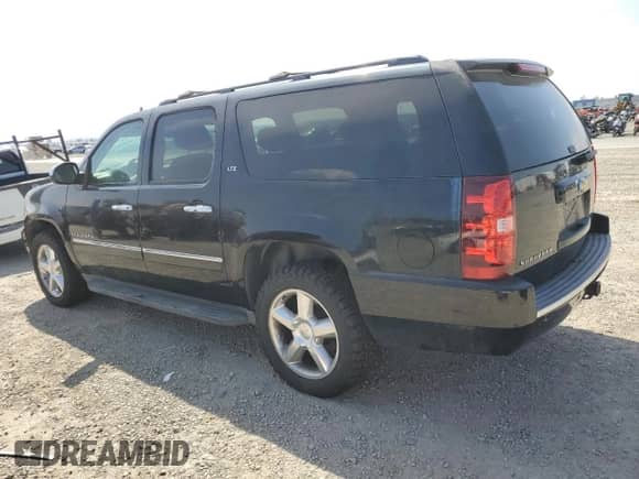 2010 Chevrolet Suburban LTZ with VIN 1GNUKKE31AR271907, listed as a Copart auction lot 81154985 with 193,228 mi miles and Salvage title. Bid and sale history available at DreamBid. Image 2.