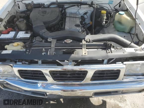 1997 Nissan Frontier XE z VIN 1N6SD16S0VC375529, wystawiony jako Copart lot #86494775 z przebiegiem 213 277 mil mil oraz Szkoda całkowita • Salvage title. Historia ofert i sprzedaży dostępna na DreamBid. Obrazek 11.