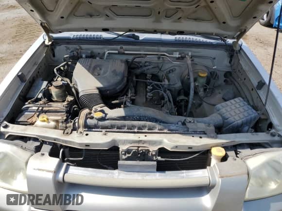 2001 Nissan Frontier XE with VIN 1N6DD26S51C371095, listed as a Copart auction lot 64691975 with 203,794 mi miles and Clean title. Bid and sale history available at DreamBid. Image 11.