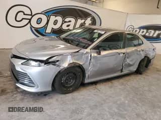 2022 Toyota Camry Hybrid LE with VIN 4T1C31AK8NU577381, listed as a Copart auction lot 83799825 with 60,855 mi miles and Salvage title. Bid and sale history available at DreamBid. Image 1.