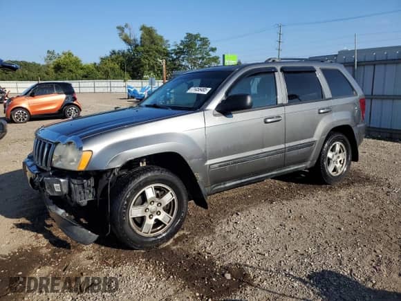 2007 Jeep Grand Cherokee Laredo with VIN 1J8GR48KX7C593322, listed as a Copart auction lot 71458485 with 166,252 mi miles and Salvage title. Bid and sale history available at DreamBid. Image 1.