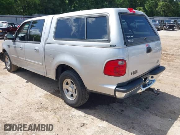 2002 Ford F-150 XLT with VIN 1FTRW07602KB73444, listed as a IAAI auction lot 42744286 with 208,152 mi miles and . Bid and sale history available at DreamBid. Image 3.