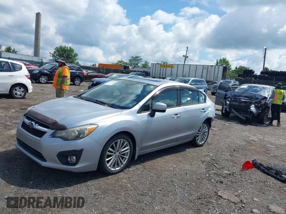 2012 Subaru Impreza Premium with VIN JF1GJAD60CH021698, listed as a IAAI auction lot 42740681 with 51,911 mi miles and . Bid and sale history available at DreamBid. Image 2.