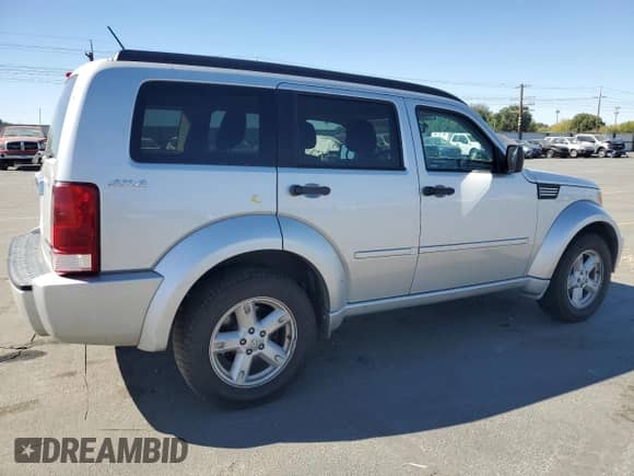 2011 Dodge Nitro SXT with VIN 1D4PU5GKXBW579119, listed as a Copart auction lot 84003925 with 185,345 mi miles and Salvage title. Bid and sale history available at DreamBid. Image 3.