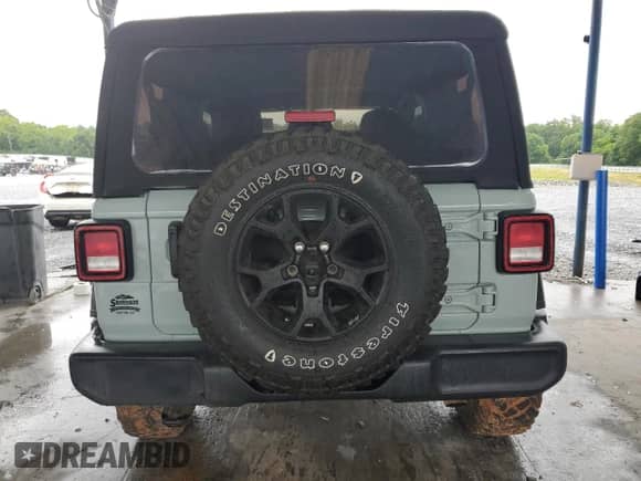 2023 Jeep Wrangler Sport with VIN 1C4HJXAG3PW633586, listed as a Copart auction lot 58744785 with 32,212 mi miles and Salvage title. Bid and sale history available at DreamBid. Image 6.