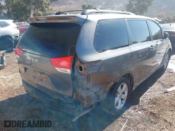 2014 Toyota Sienna LE AAS with VIN 5TDKK3DC5ES464205, listed as a IAAI auction lot 43066275 with 194,999 mi miles and . Bid and sale history available at DreamBid. Image 4.