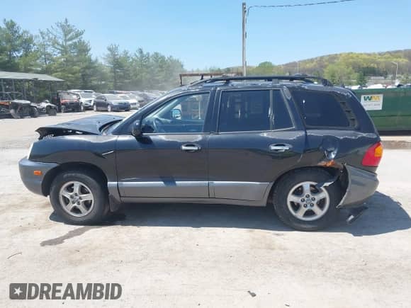 2002 Hyundai Santa Fe GLS z VIN KM8SC73D42U281993, wystawiony jako IAAI lot #42098783 z przebiegiem 256 094 mil mil oraz . Historia ofert i sprzedaży dostępna na DreamBid. Obrazek 14.
