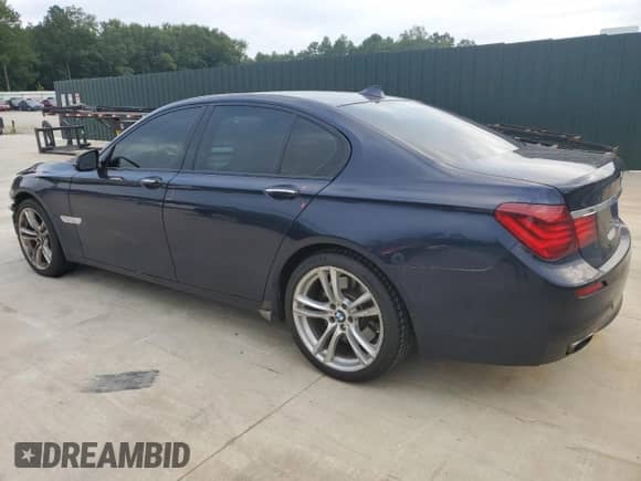 2015 BMW 7 Series 750i with VIN WBAYA8C51FG197764, listed as a Copart auction lot 67095554 with 167,458 mi miles and Salvage title. Bid and sale history available at DreamBid. Image 2.