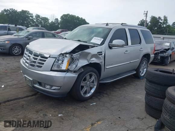 2011 Cadillac Escalade with VIN 1GYS3AEF9BR268475, listed as a IAAI auction lot 42611620 with 165,000 mi miles and . Bid and sale history available at DreamBid. Image 2.