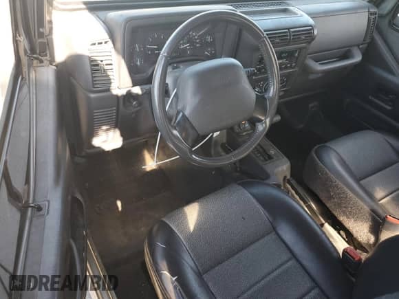 2000 Jeep Wrangler SE with VIN 1J4FA29P4YP775935, listed as a Copart auction lot 80458955 with 100,211 mi miles and Salvage title. Bid and sale history available at DreamBid. Image 8.