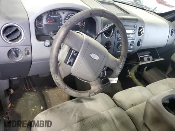 2007 Ford F-150 XLT with VIN 1FTRW12W37KD04161, listed as a Copart auction lot 82055735 with 163,774 mi miles and Salvage title. Bid and sale history available at DreamBid. Image 8.