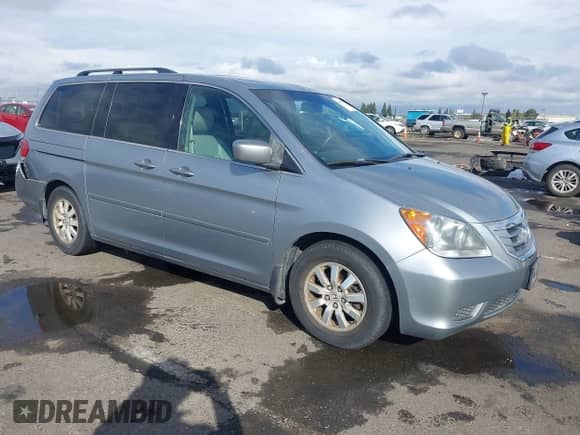 2008 Honda Odyssey EX-L with VIN 5FNRL38628B104477, listed as a IAAI auction lot 43363199 with 220,595 mi miles and . Bid and sale history available at DreamBid. Image 1.