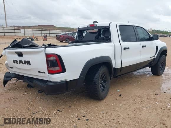 2023 Ram 1500 TRX z VIN 1C6SRFU90PN503803, wystawiony jako IAAI lot #42659089 z przebiegiem 35 642 mil mil oraz . Historia ofert i sprzedaży dostępna na DreamBid. Obrazek 4.