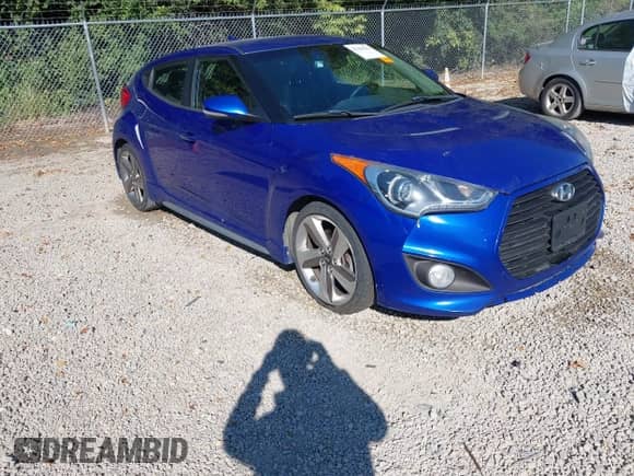 2013 Hyundai Veloster Turbo с VIN KMHTC6AE7DU140638, выставлен на аукционе IAAI как лот 43169612 с пробегом 162 811 миль миль и . История ставок и продаж доступна на DreamBid. Изображение 1.