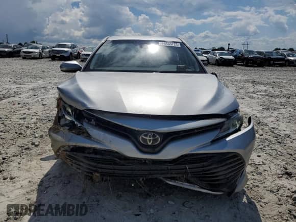 2019 Toyota Camry LE с VIN 4T1B11HKXKU193153, выставлен на аукционе Copart как лот 66660725 с пробегом 130 057 миль миль и Списание • Salvage title. История ставок и продаж доступна на DreamBid. Изображение 5.