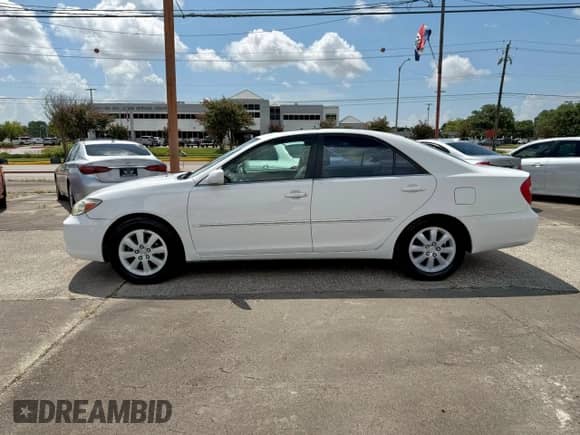 2002 Toyota Camry LE с VIN 4T1BE32K52U027812, выставлен на аукционе Copart как лот 69159455 с пробегом 174 527 миль миль и Чистый • Clean title. История ставок и продаж доступна на DreamBid. Изображение 14.