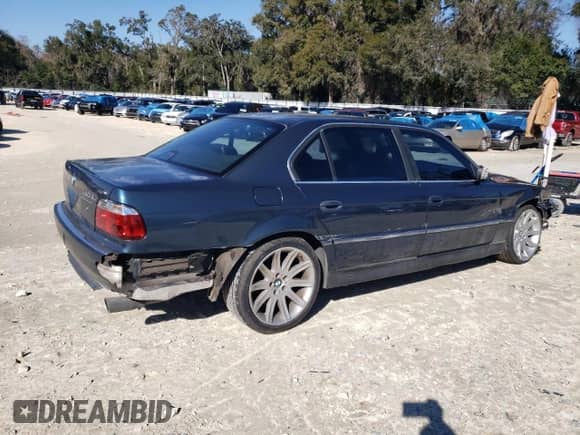 1997 BMW 7 Series 740iL with VIN WBAGJ8327VDL42579, listed as a Copart auction lot 42023485 with 143,882 mi miles and Salvage title. Bid and sale history available at DreamBid. Image 3.