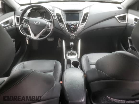 2015 Hyundai Veloster z VIN KMHTC6AD5FU223446, wystawiony jako Copart lot #69798925 z przebiegiem 81 772 mil mil oraz Szkoda całkowita • Salvage title. Historia ofert i sprzedaży dostępna na DreamBid. Obrazek 8.