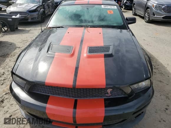 2009 Ford Mustang Shelby GT500 z VIN 1ZVHT88S995128314, wystawiony jako Copart lot #68973314 z przebiegiem 74 339 mil mil oraz Szkoda całkowita • Salvage title. Historia ofert i sprzedaży dostępna na DreamBid. Obrazek 11.