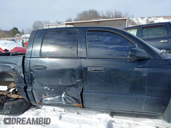 2005 Dodge Dakota SLT with VIN 1D7HW48K15S316393, listed as a IAAI auction lot 41379072 with 207,639 mi miles and . Bid and sale history available at DreamBid. Image 14.